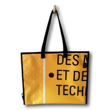 Charger l'image dans la galerie, Sac fourre-tout fait de matériaux récupérés. couleur: jaune, blanc et noir. Ferme avec 4 boutons à pression. Fabriqué au Québec pour un produit local.